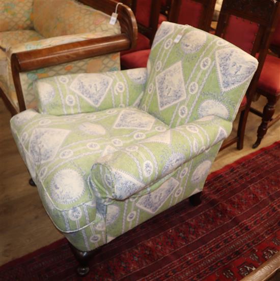 An early 20th century upholstered armchair